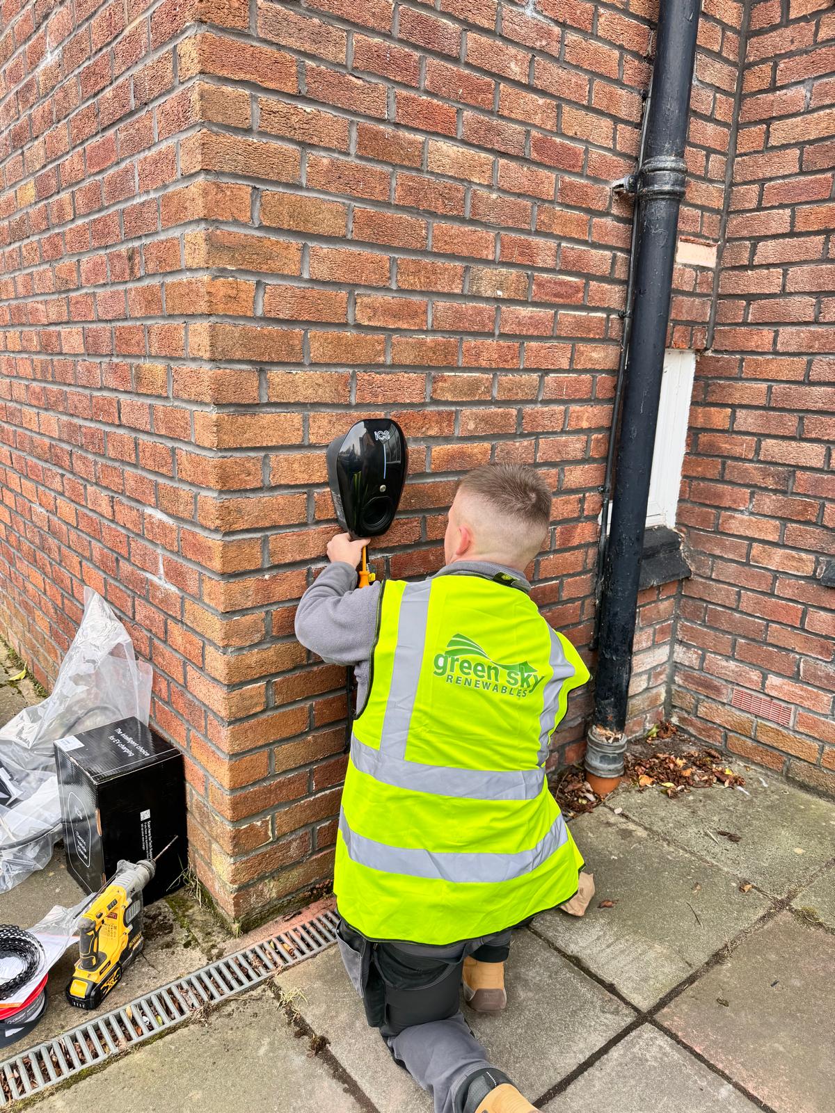Engineer installing an ICS EV charger in Manchester