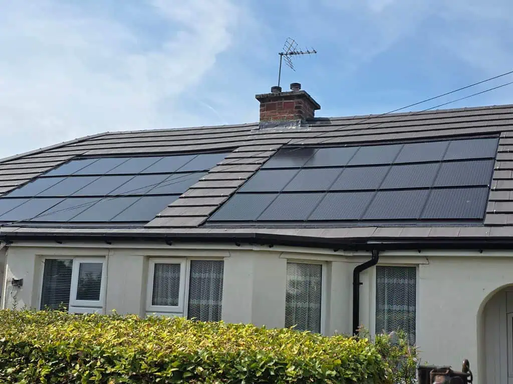 Residential house with solar panels on roof and chimney