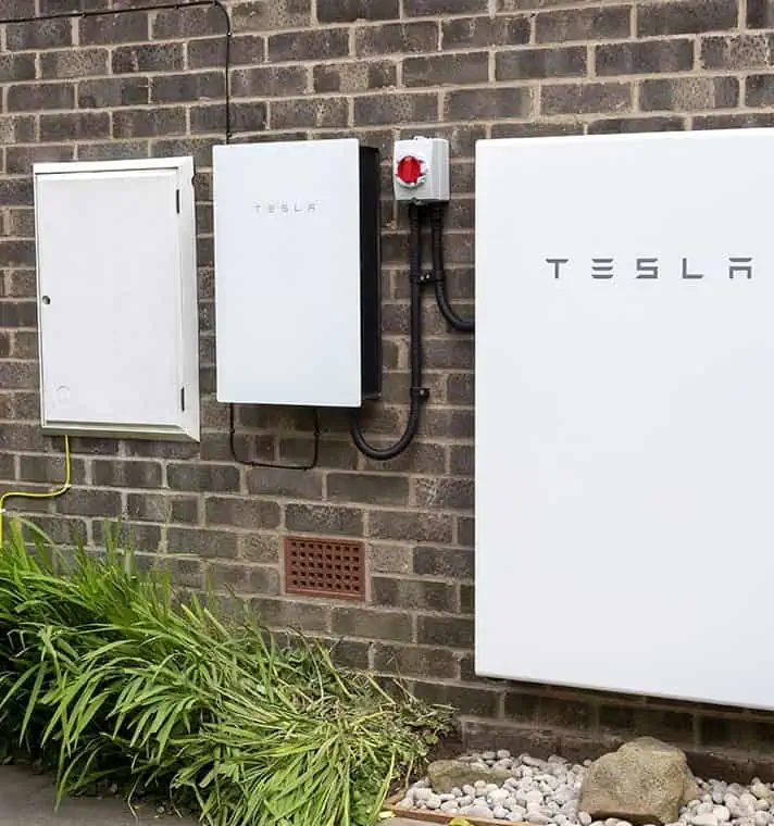 Home battery storage units mounted on an exterior wall